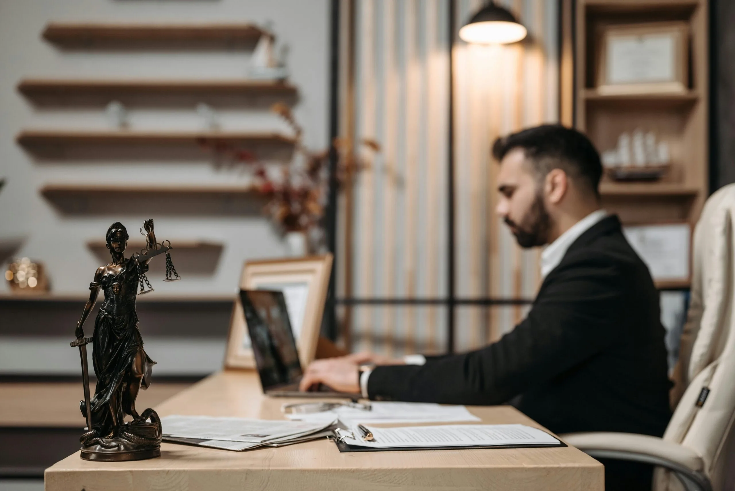 Lawyer reviewing legal documents at a desk