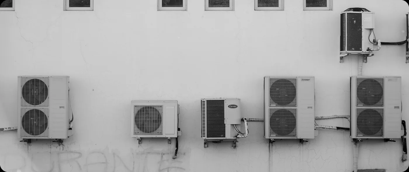 HVAC technician servicing a rooftop unit