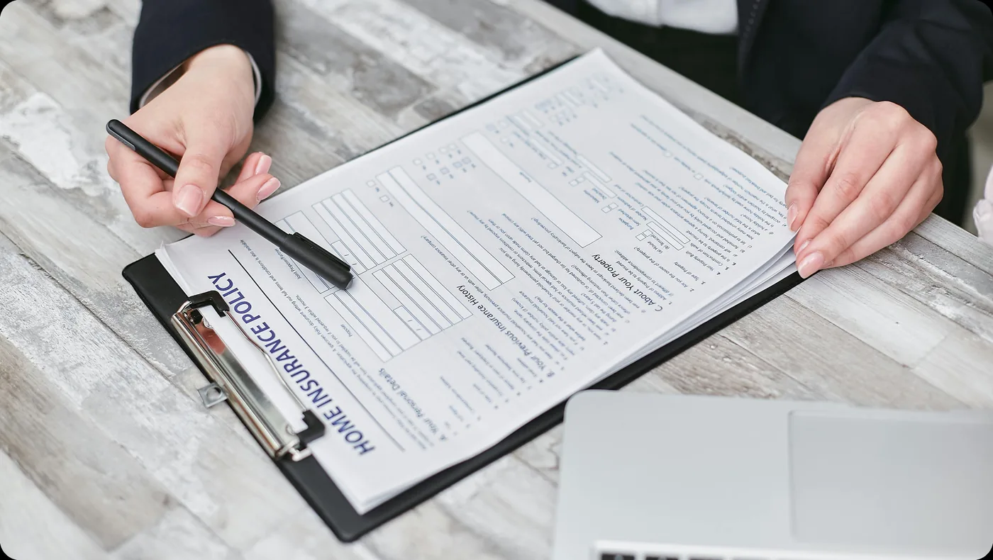 Insurance professional reviewing policy documents