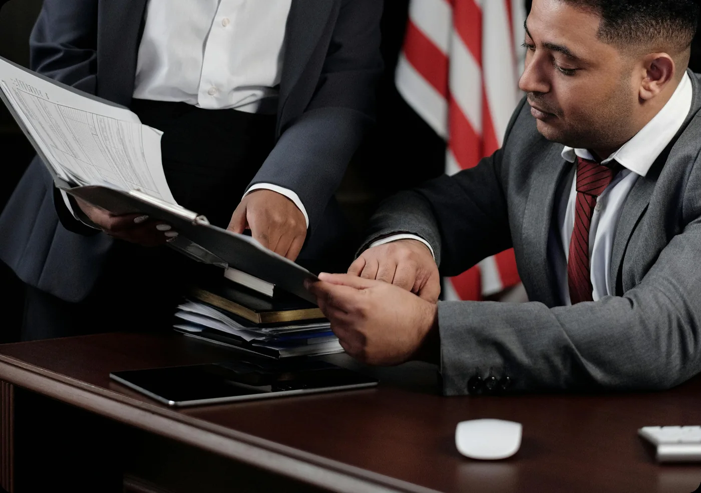 Lawyer reviewing legal documents at a desk