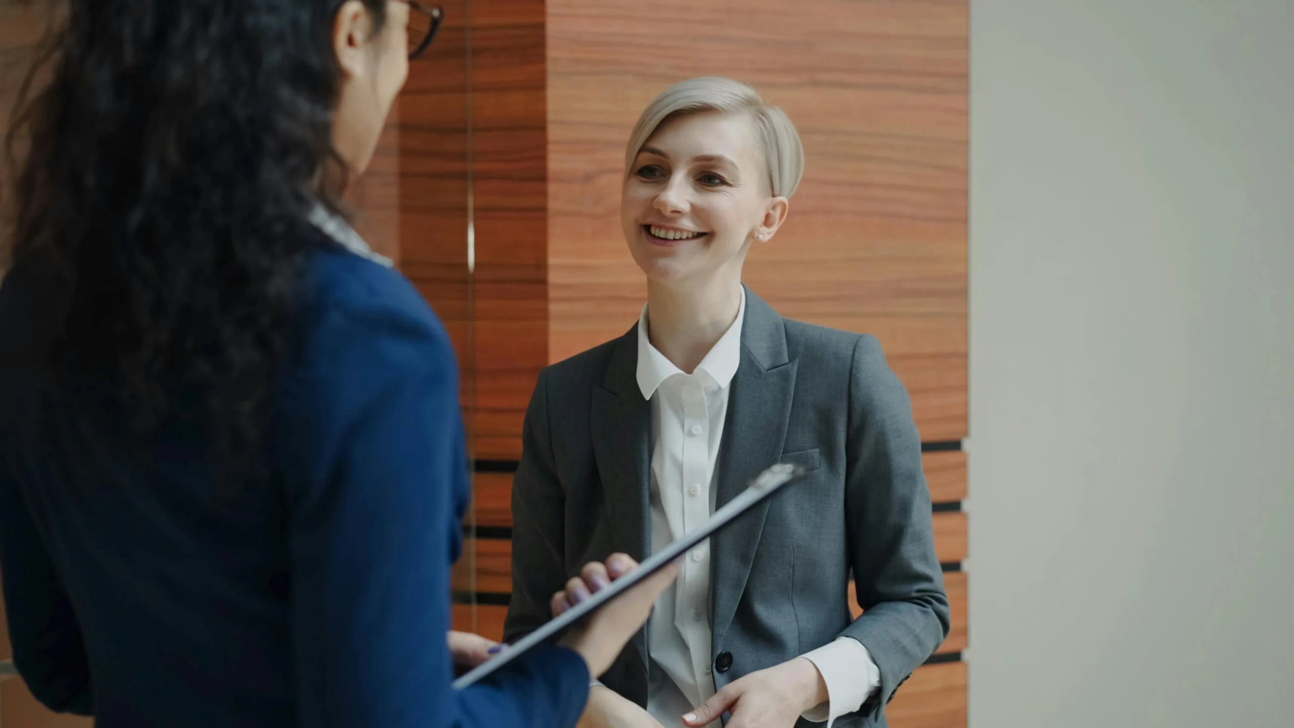 HR professional in a meeting discussing employee coordination and administrative workflows