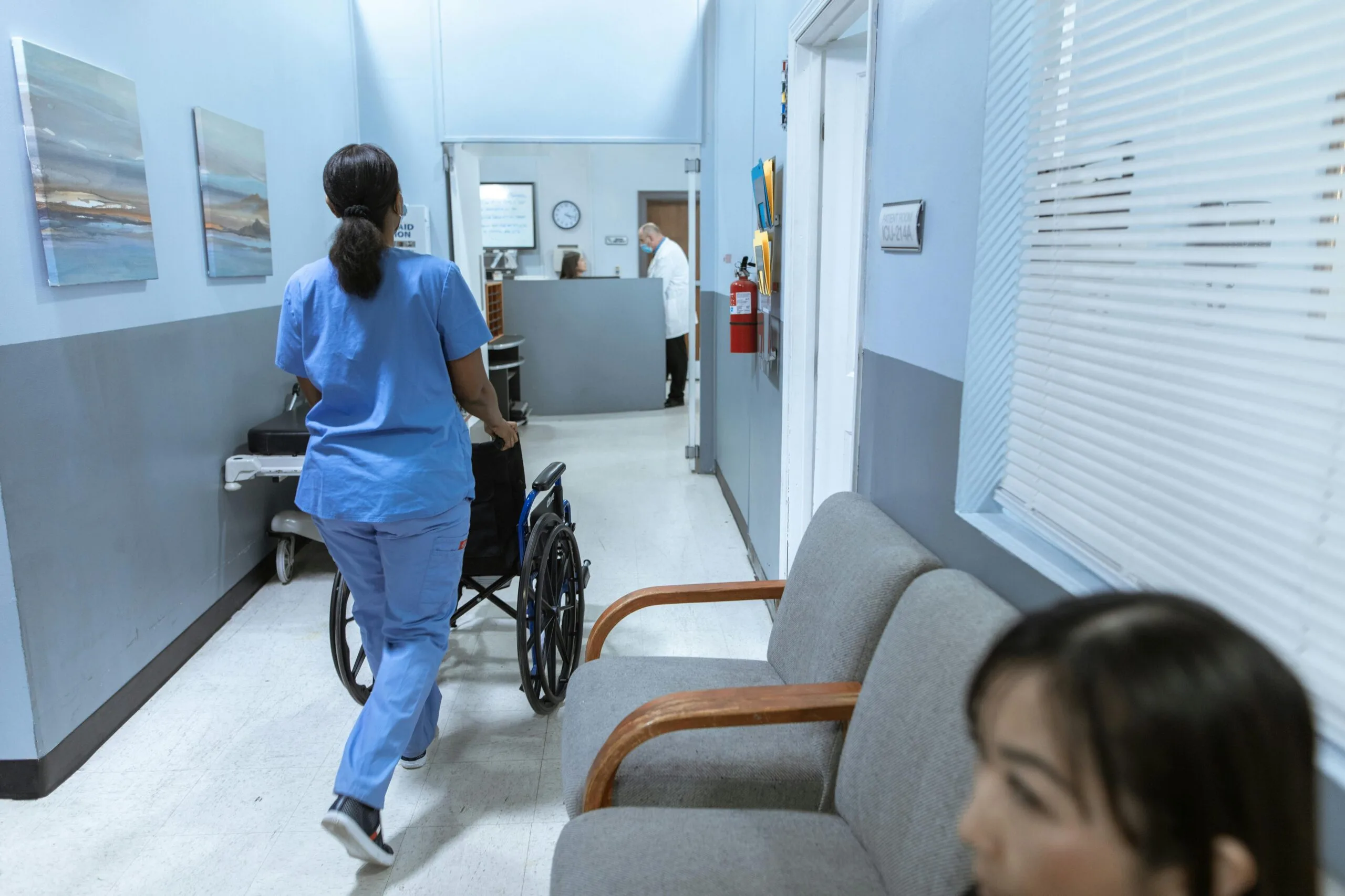 Healthcare professional reviewing patient records at a medical facility